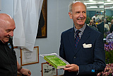 Andrew Boyd gets a book of plays from James McArevey. - Boyds Stores Newry Maritime Association Tribute