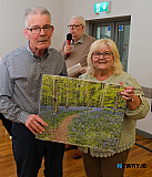 John McSherry receives a print of the bluebell wood at Warrenpoint from  - Newry Gateway Club Volunteer John McSherry retirement