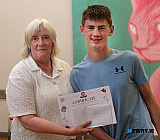 Margaret McShane, Newry Gateway Club presents a Certificate of Achievement to Callum Magee from Mayobridge.  - Newry Gateway Club Volunteer John McSherry retirement