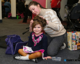 Ashling Wylie, Newry, gets her daughter Mia ready for the Irish Dancing competition at the opening of Newry Musical Feis 2025 in The Quays. - Newry Musical Feis 2025