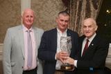 Sean O&rsquo;Hanlon presents the Pat O&rsquo;Hanlon Hall of Fame Award to John Moley while
St Killian's Chairman Kieran Shields looks on.
Photograph: Columba O'Hare/ Newry.ie - St Killian's GAC Annual Dinner 2026