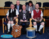 Cllr Mickey Ruane, Chairperson, Newry, Mourne and Down District Council presents Martin and Ronan Fitzpatrick with an award to mark their wins in the World Pipe Band Championships. Looking on are Cllrs Charlie Casey and Valerie Harte. Photograph: Columba O'Hare - Martin and Ronan Fitzpatrick and Orlaith Hollywood council presentation