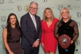 GAA President Jarlath Burns with St Killian's Senior Ladies Kate McKenna, Fiona O'Hanlon and Anna Ferris, hoding the Division 4 Shield at the St Killian&rsquo;s GAC Annual Dinner Dance in the Canal Court, Newry. Photograph: Columba O'Hare/ Newry.ie  - St Killian's GAC Annual Dinner 2026