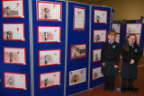 Gabriella Lukaszuk and Marleigh King from P4 at St Malachy's Primary School with some of their class's art based on work from artist Banksy. Photograph: Columba O'Hare/ Newry.ie - St Malachy's PS Art Exhibition for Anti Bullying Week