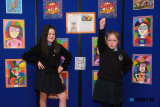 'Superheroes' Emily Cunanne and Tara Savage from The Happy Hub at St Malachy's PS with some of their class's artwork based around artist Romero Britto. Photograph: Columba O'Hare/ Newry.ie - St Malachy's PS Art Exhibition for Anti Bullying Week