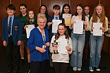 Sofia Plumb, Lurgan the winner in Favourite Poem, over 12 and under 14 gets presented with the Bright Sports Cup, by Adjudicator Katrina Mulvihill, for winning the Favourite Poem, over 12 and under 14 class at Newry Feis. Also pictured are other class entrants with their certificates. Photograph: Columba O'Hare/ Newry.ie - Newry Musical Feis 2026