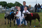 Sophie, right, and Emilie McCullough, Dromara, 1st and 2nd respectively in the Young Handliing Competition at Newry Show. Also included is Judge of the event James Herdman. - Newry Show 2025