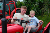 Jackson Cartmill and son Harry who's almost 3 enjoying the Charity Tractor Run at Drumgath in memory of Patrick (Paddy) McAvoy. Photograph: Columba O'Hare/ Newry.ie  - Charity Tractor Run Drumgath