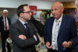 Newry and Armagh MP, D&aacute;ire Hughes speaks to Miami Showband Road Manager Brian MAguire during the 50th Anniversary commemorations of the Miami Showband massacre. - Miami Showband massacre 50th Anniversary Commemoration
