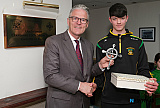 James Byrne, St Michael's GAC U16 team presents a gift to GAA President Jarlath Burns to commemorate his visit to the club. Photograph: Columba O'Hare/ Newry.ie  - GAA President Jarlath Burns visits St Michael's GAC Killean
