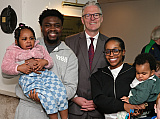 GAA President Jarlath Burns meets the Olubunmi family at St Michael's GAC, Killean. coh  - GAA President Jarlath Burns visits St Michael's GAC Killean