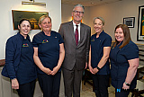 Killean Playschool staff with GAA President Jarlath Burns. - GAA President Jarlath Burns visits St Michael's GAC Killean