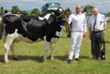 Newry Show Society president, Tommy Collins, congratulates Cameron Magowan on winning the dairy championship at Newry Show 2023 - Newry Show 2023