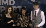 Maria Cassidy, Newry Rowing Club and Jake Medine, Ballynahinch Olympic FC, joint winners of Junior Club Coach of the year for 2024, being presented with their awards by Councillor Valerie Harte.
 - NMD Sports Awards 2025