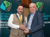 Chairperson Councillor Pete Byrne presents Dominic Quinn with a Civic Award in the Community And Voluntary Category for his services to Saval GAC.  - Newry, Mourne and Down District Council Civic Awards 2024
