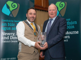 Chairperson Councillor Pete Byrne presents Brendan McKernan with a Civic Award in the Sport Category for his dedication of over 40 years to Burren Football and Social Club. - Newry, Mourne and Down District Council Civic Awards 2024