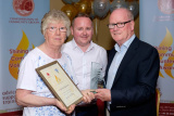 Sylvia McElroy, Newry Gateway Club was the Award Recipient of the Age 65+ category in the Confederation of Community Groups, Patricia Graham Shining Light Community Volunteering Awards 2017. Peter McEvoy, Newry and Mourne Enterprise Agency, sponsor, is pictured making the presentation with Shea Graham , family representative . Photograph: Columba O'Hare - Shining Light Awards 2017