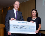At the Shining Light Awards, Raymond Jackson, Chief Executive, CCG presents a donation of &pound;500 to Andrea McCann who received it on behalf of Southern Area Hospice. Photograph: Columba O'Hare - Shining Light Awards 2017