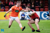 Down's Conor Clarke is tackled by Armagh's Jamie Haughey. Down Minors v Armagh Minors at Pairc Esler. Photograph: Columba O'Hare - Down v Armagh Championship Pairc Esler 2017