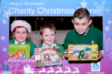 Katie Toner, Ciaran Meehan and Keelan Toner are pictured here with some of the toys donated on the night for local children, at the Newry Chamber of Commerce Christmas Charity Lunch. Photograph: Columba O'Hare - Newry Chamber of Commerce Christmas Charity Dinner 2017