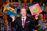 Paul Convery, President, Newry Chamber of Commerce with some of the items from the toy mountain at the Newry Chamber of Commerce Christmas Charity Lunch. Photograph: Columba O'Hare - Newry Chamber of Commerce Christmas Charity Dinner 2017