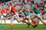 Armagh's James Donnelly breaks away from his Mayo opponents at Sunday's All Ireland Minor Football Final. - All Ireland Minor Football Final 2009 Armagh v Mayo