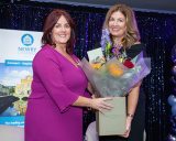 Edwina Flynn, incoming president of Newry Chamber, presents a bouquet of flowers to Julie Gibbons in recognition of her services to the chamber during the past two years at Friday&rsquo;s president&rsquo;s lunch held in the Canal Court Hotel. - Newry Chamber President's Banquet