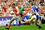 Armagh's Steven McDonnell, breaks away from Laois player Joe Higgins. Photo: Columba O'Hare - Armagh v Laois 2003