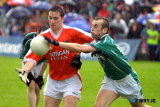 Armagh's, John McEntee comes under pressure in attrocious conditions at Roscommon. Photo: Columba O'Hare - Armagh v Limerick July 2003