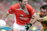 Steven McDonnell heads away from his Donegal marker at the Ulster Final in Croke Park. - Armagh v Donegal Ulster Final 2006
