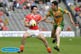 Armagh's Aaron Kernan keeps Donegal's Rory Kavanagh at arms length at the Ulster Final. - Armagh v Donegal Ulster Final 2006