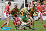 Martin O'Rourke holds on for dear life against Donegal in Sunday's Ulster Final. - Armagh v Donegal Ulster Final 2006