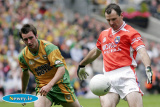 Armagh's Steven McDonnell gets his shot in while Donegal's Karl Lacey looks worried. - Armagh v Donegal Ulster Final 2006