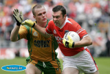 Oisin McConville comes under close scrutiny from Donegal's Neil McGee at the Ulster Final in Croke Park. - Armagh v Donegal Ulster Final 2006
