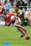 Armagh's Martin O'Rourke breaks away from Donegal's Damian Diver at Croke Park. - Armagh v Donegal Ulster Final 2006