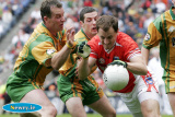 Paddy McKeever fends of his Donegal markers at the Ulster Final. - Armagh v Donegal Ulster Final 2006