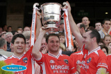 Armagh's Michael, Aidan and Martin O'Rourke lift the Anglo Celt cup at Croke Park on Sunday. - Armagh v Donegal Ulster Final 2006