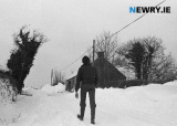 Walking past John Brown's Blacksmiths shop, Mavemacullen, Tandragee in January 1982. Photograph: Columba O'Hare/ Newry.ie - The Big Snow of January 8 1982