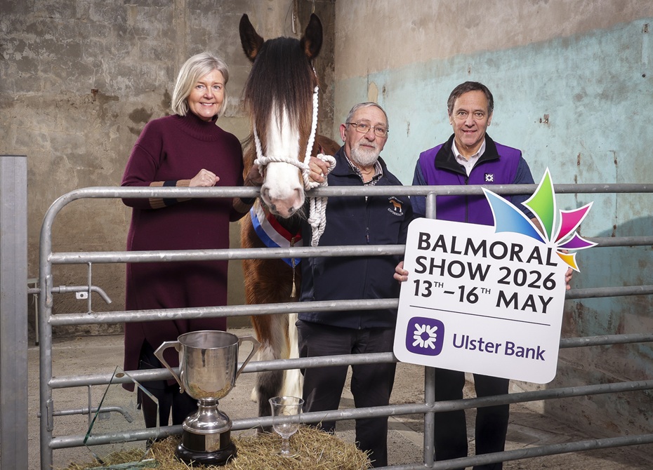 Rhonda Geary, RUAS Group Operations Director and Cormac McKervey, Senior Agriculture Manager, Ulster Bank, kick off the countdown to the 2026 Balmoral Show in partnership with Ulster Bank. The pair are joined by county Antrim farmer, John Cross, who received the award for Champion Clydesdale at the 2025 event. Photograph: Brian Thompson
