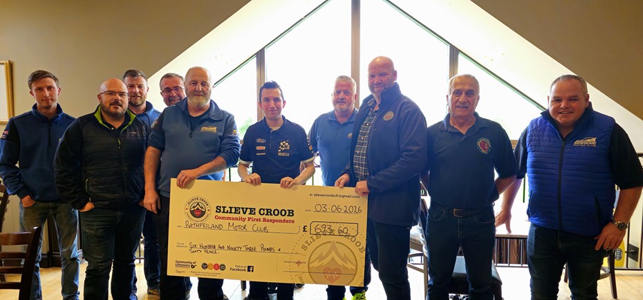 Rathfriland Motor Club members present a cheque for £693.60 to Slieve Croob First Responders.