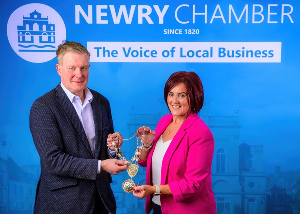 Outgoing Chamber President, Edwina Flynn handing over the Chains of Office to the New President, Dr Conor Patterson who was elected at this year’s AGM.