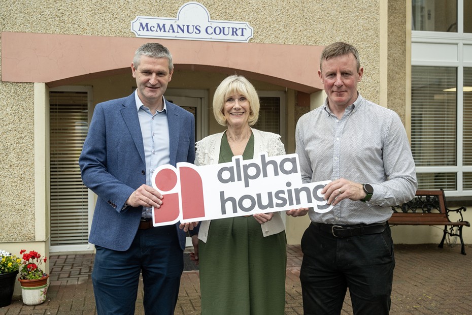Martin Quinn, Head of Homes and Communities at Alpha Housing; Margaret McVeigh, tenant at McManus Court and Justin McNulty, MLA at the re-opening of McManus Court.