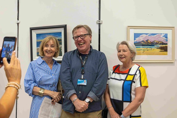 Art lecturer Nigel Whiteside with attendees at the Recreational Art end of year exhibition.
