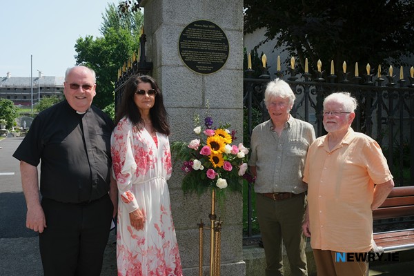 Canon Francis Brown and Siobhan Burns, Newry Cathedral Parish with Peter Sinclair, Sinclair Trust and Tom Moore, Old Newry Society at the plaque unveiled at Newry Cathedral Garden the site of Newry Mills. Photograph: Columba O’Hare/ Newry.ie 