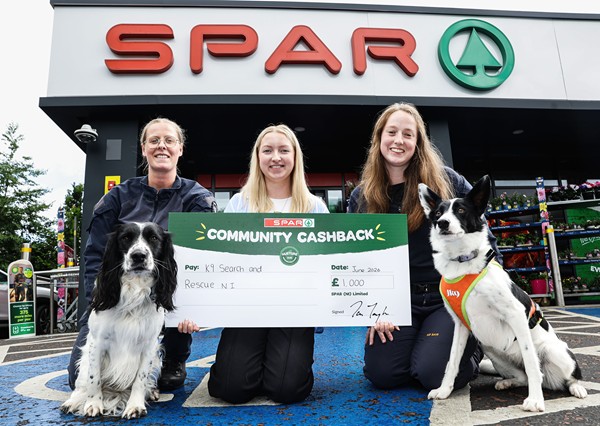 K9 Search and Rescue: Cheridan Scott (left) and Ellie Macleod (right) are pictured with K9 Search and Rescue dogs Travis and Boo and Bethany Priestley (centre) from SPAR NI, receiving £1,000 as part of the 2026 SPAR Community Cashback Grant.
