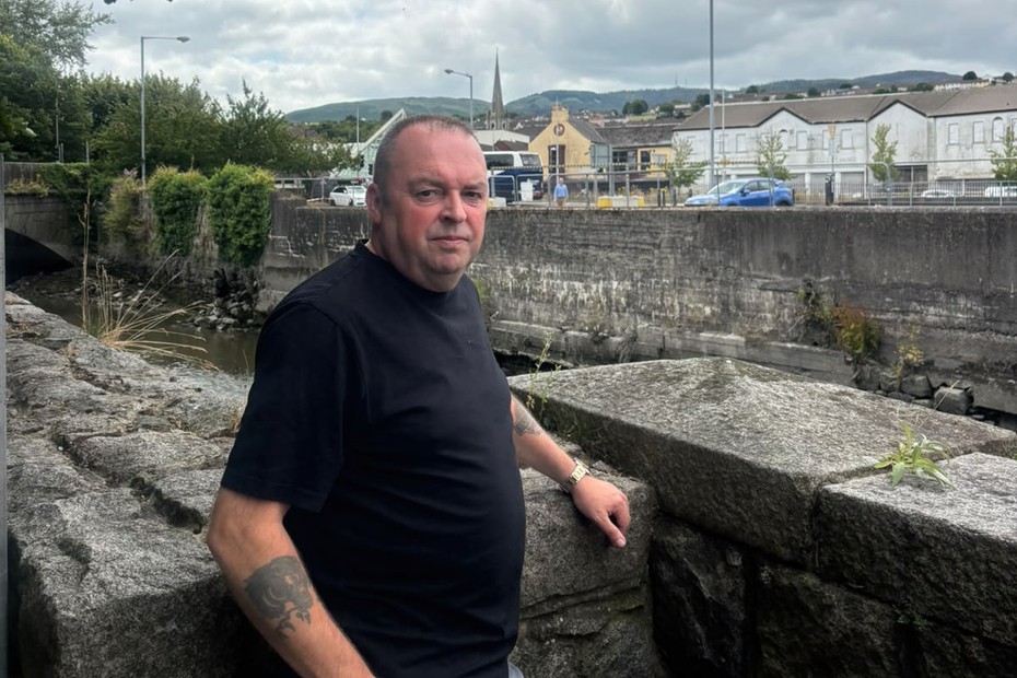 Cllr Aidan Mathers at the side of the Clanrye river in the centre of Newry