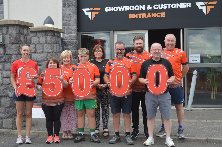 Representatives from the Desy Jennings Football Festival along with Kieran Quinn rom  Player-Fit present a cheque for £5,000 to Northern Ireland Chest Heart & Stroke.