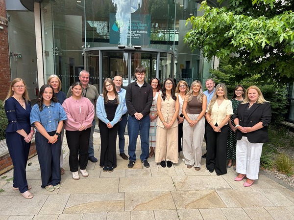 Newry, Mourne and Down District Council Chief Executive Marie Ward (right) and Human Resources and Organisational Development Manager Marina Hughes (left), with placement students and their respective line managers at the Downshire Civic Centre event. Included are managers Patricia Murtagh, Sean Robb, James Campbell, Kerri McConnell, Helen McElroy, Paul Smyth and Lynn Campbell.