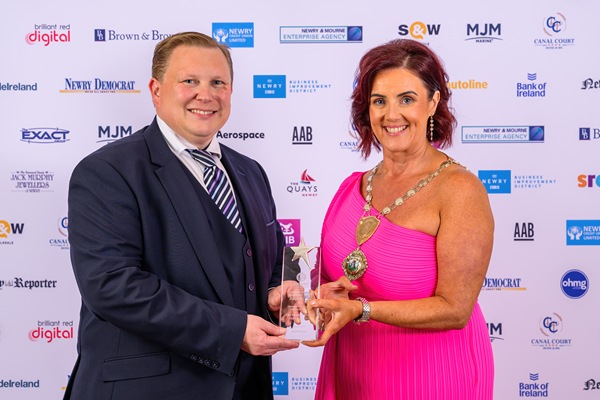 Edwina Flynn, President, Newry Chamber of Commerce receives the Greater Newry Area Diaspora Award from an MJM Marine representative on behalf of the Rooney Family - Pennsylvania, USA at the Chamber's Greater Newry Business Awards.