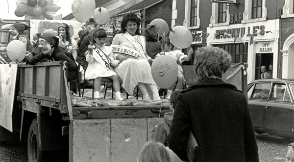 Miss Crossmaglen and South Armagh Festival Queen with Little Miss Mullaghbawn, on a float at the opening parade of the South Armagh Festival in Crossmaglen, 1985. Newry Reporter Collection, Newry & Mourne Museum Collection